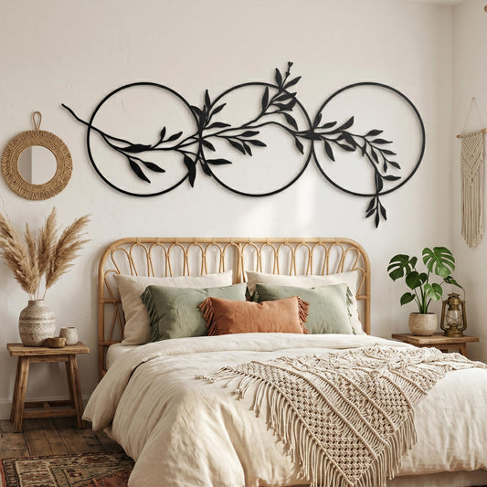 Olive Branch Circles Matte Black Steel Botanical Over Bed Horizontal Art shown on a living room wall