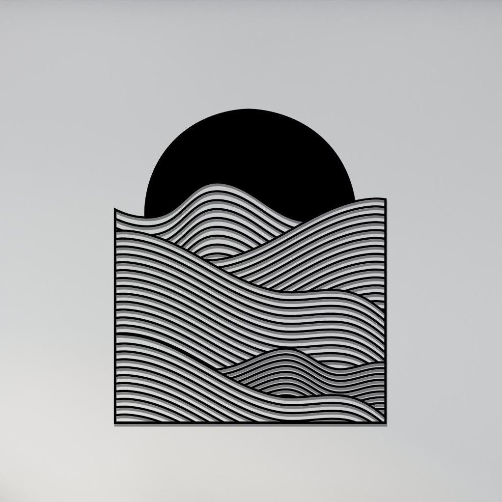 Ocean Wave Metal Wall Art shown on a living room wall