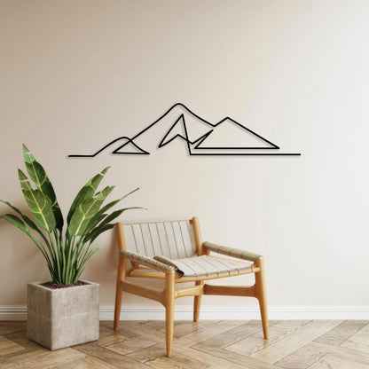 Minimalist Mountain Metal Wall Art shown on a living room wall