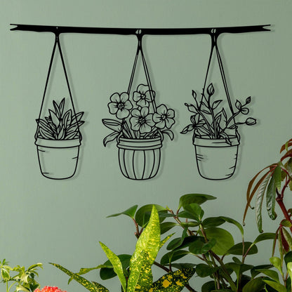 Botanical Metal Hanging Planter Wall Art shown on a living room wall