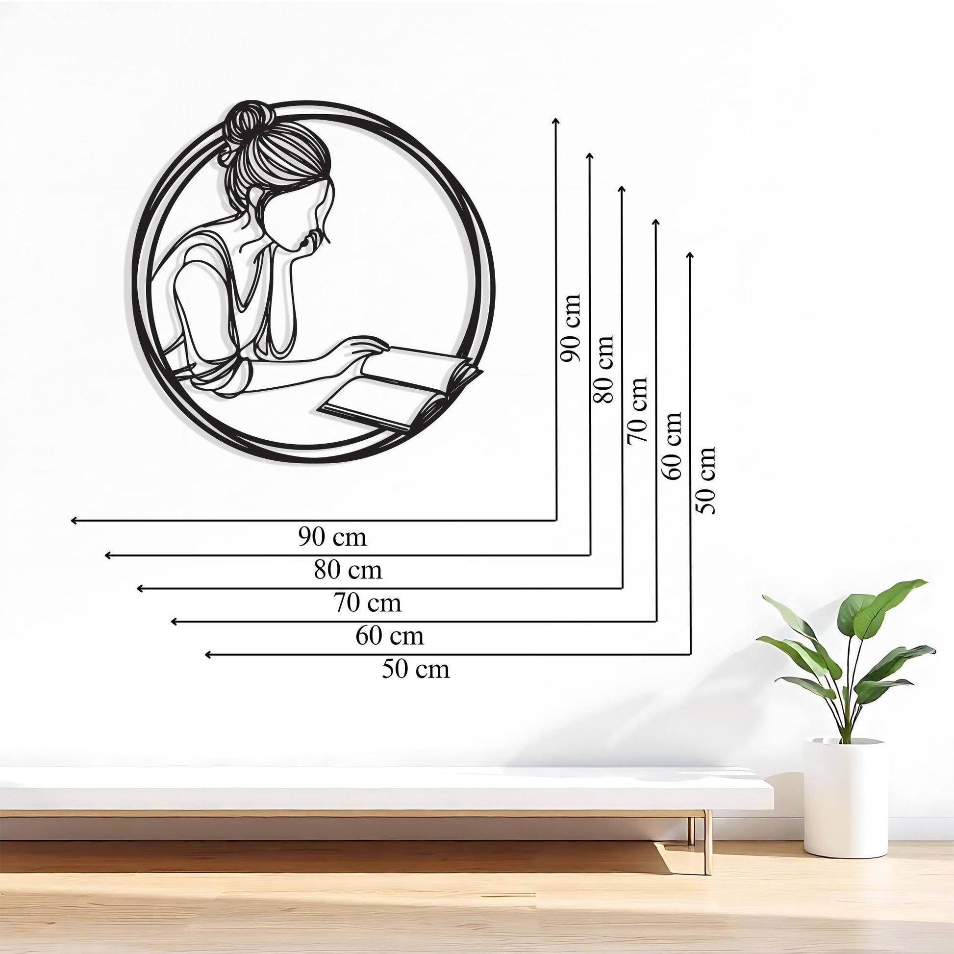Minimalist Reading Woman Metal Wall Art styled above a sofa