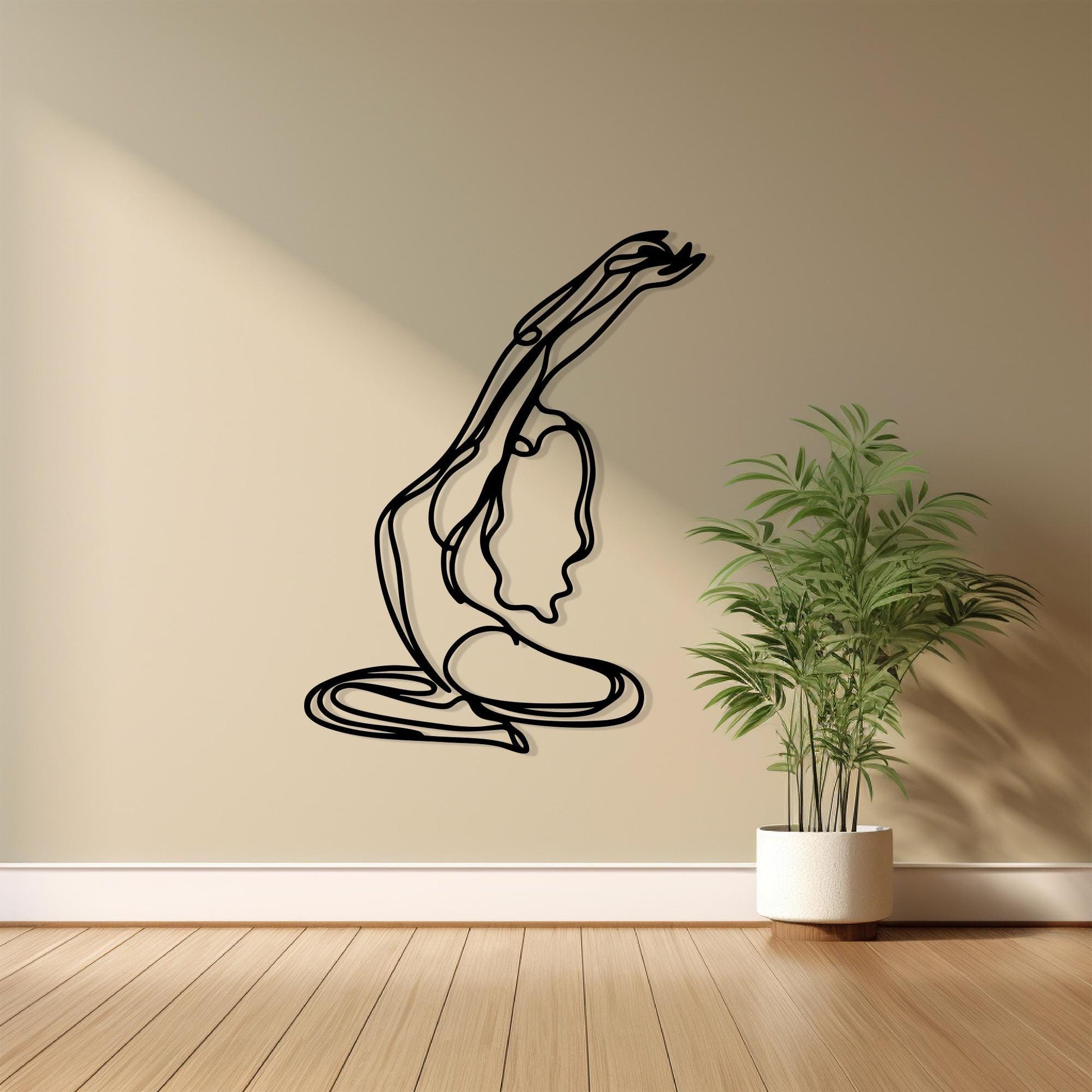 Minimalist Yoga Pose Metal Wall Art shown on a living room wall