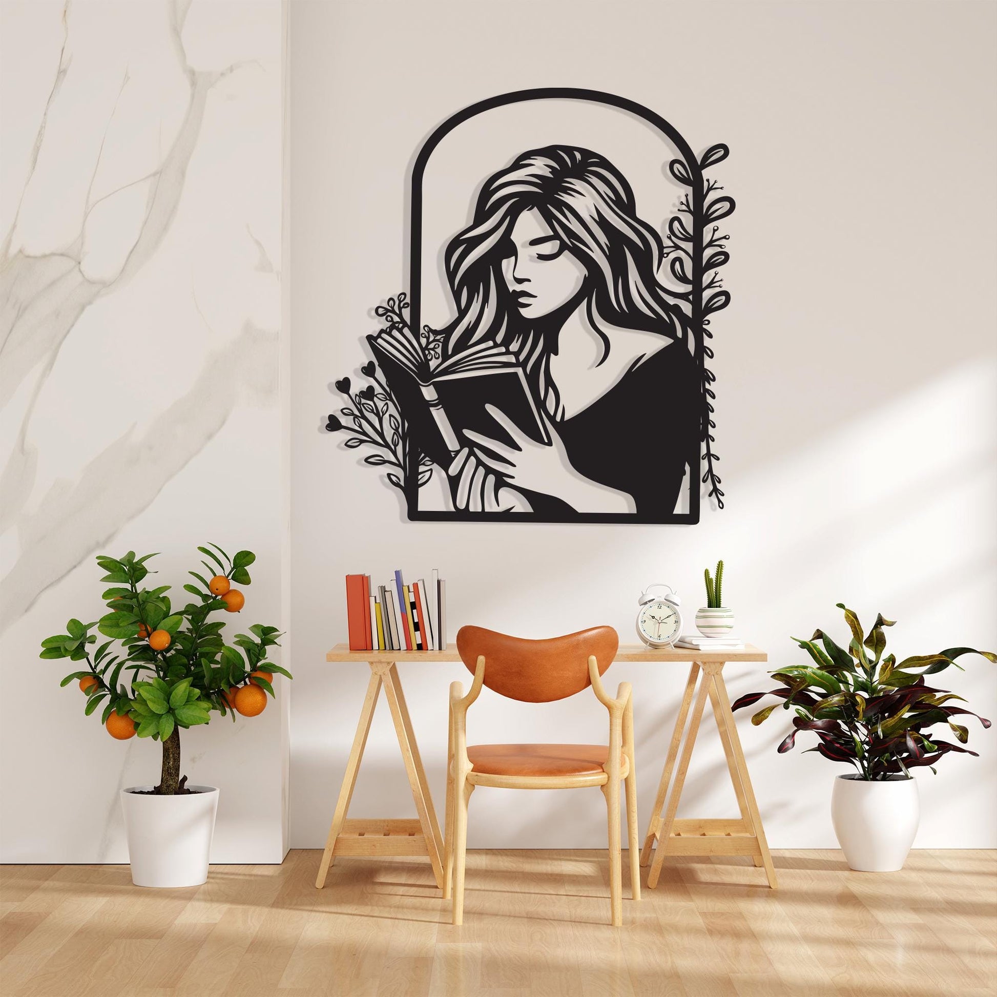 Metal Woman Reading Wall Art shown on a living room wall