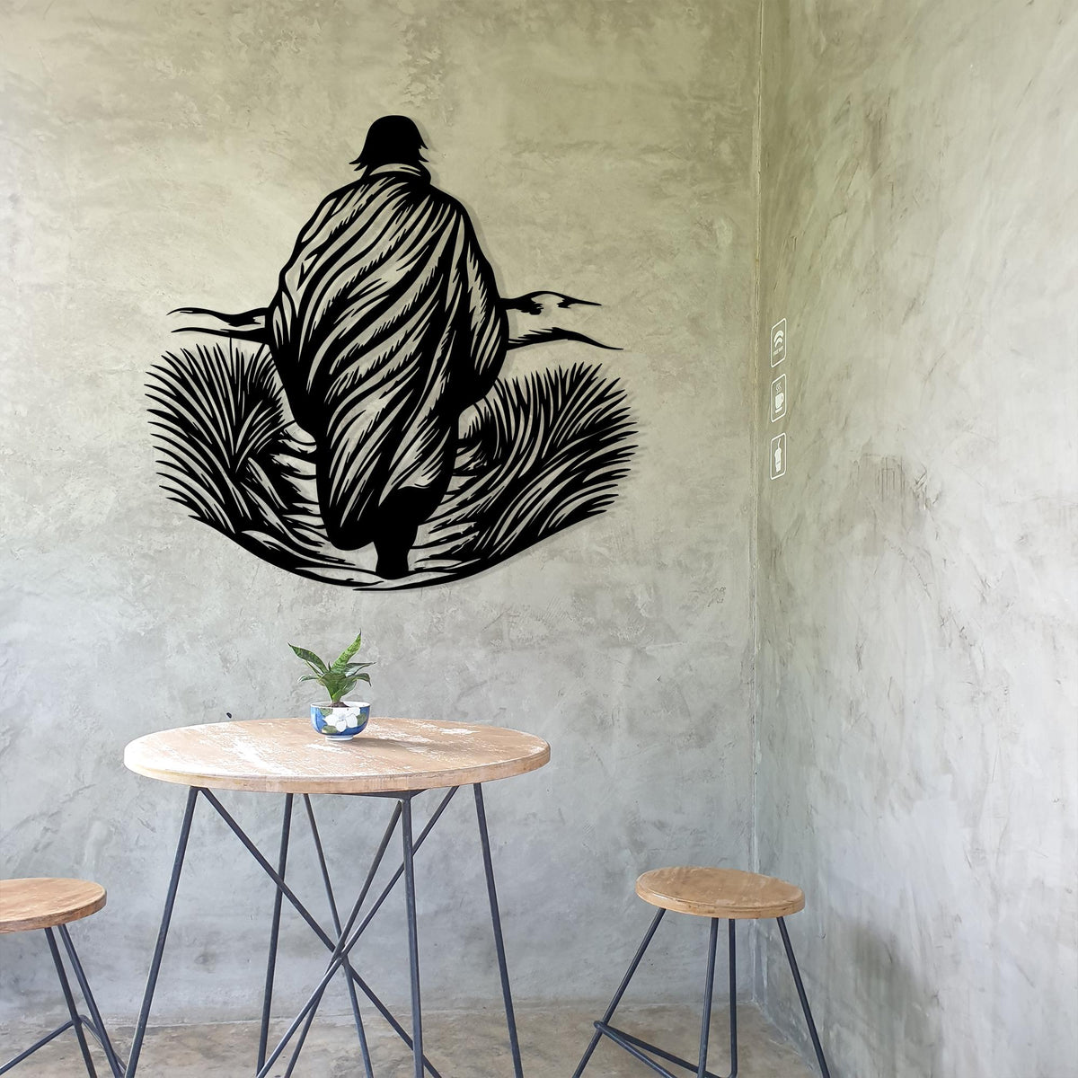 Walking Man Metal Wall Art in a modern hallway