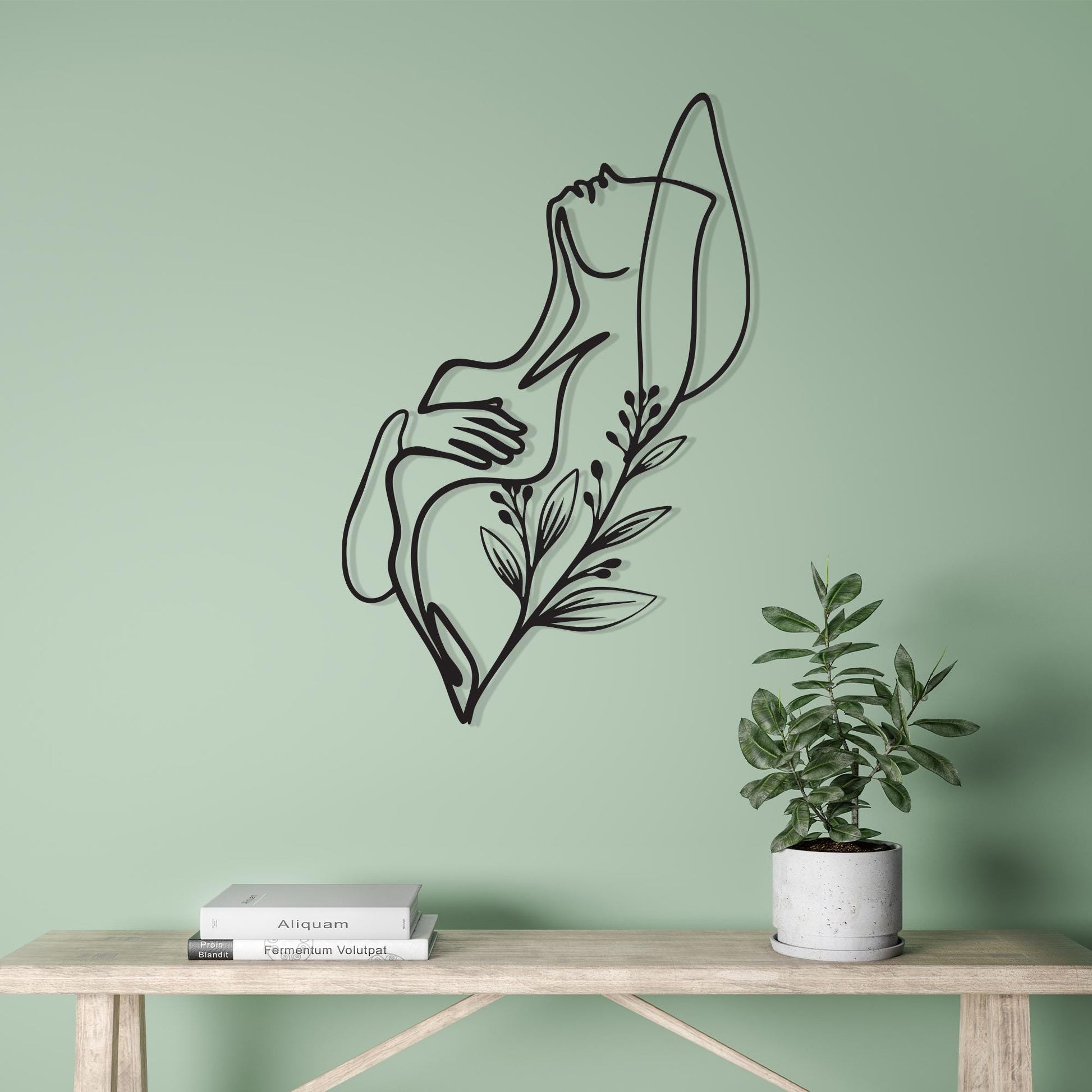 Female Body Line Art shown on a living room wall