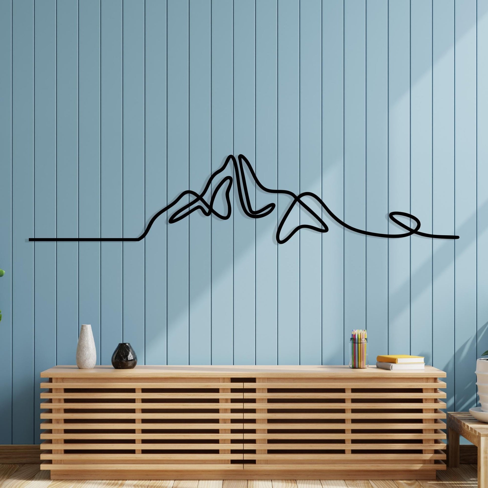Minimalist Mountain Metal Wall Art shown on a living room wall