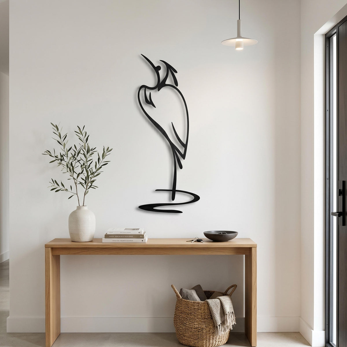 Minimalist Metal Heron Art shown on a living room wall