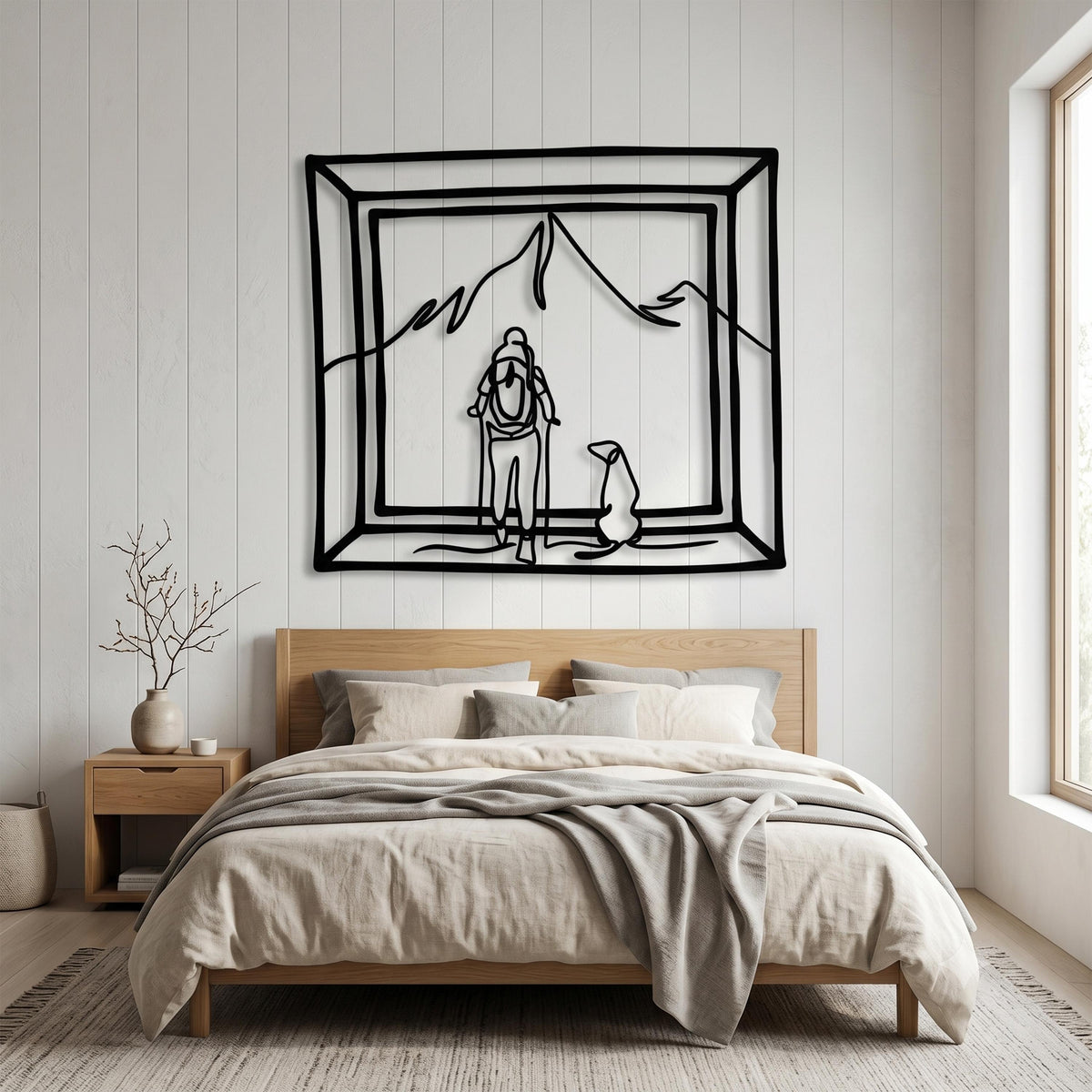 Hiker and Dog Metal Wall Art styled above a sofa