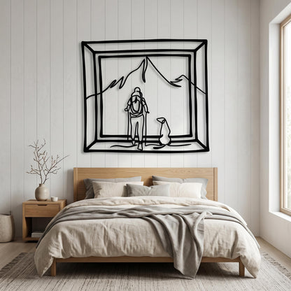Hiker and Dog Metal Wall Art styled above a sofa