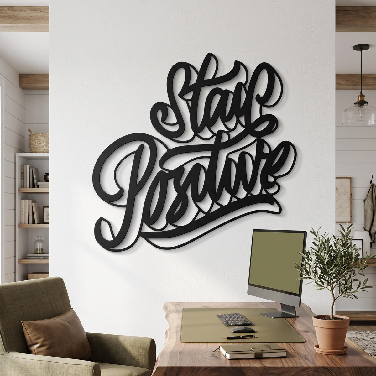 Stay Positive Metal Wall Art shown on a living room wall