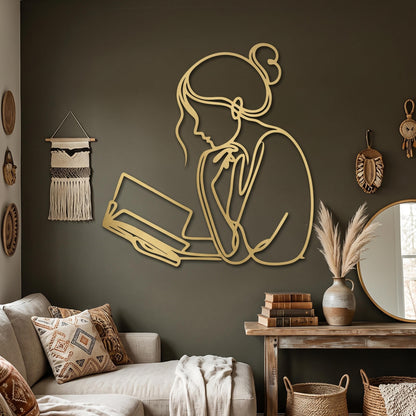Minimalist Reading Woman Metal Wall Art styled above a sofa
