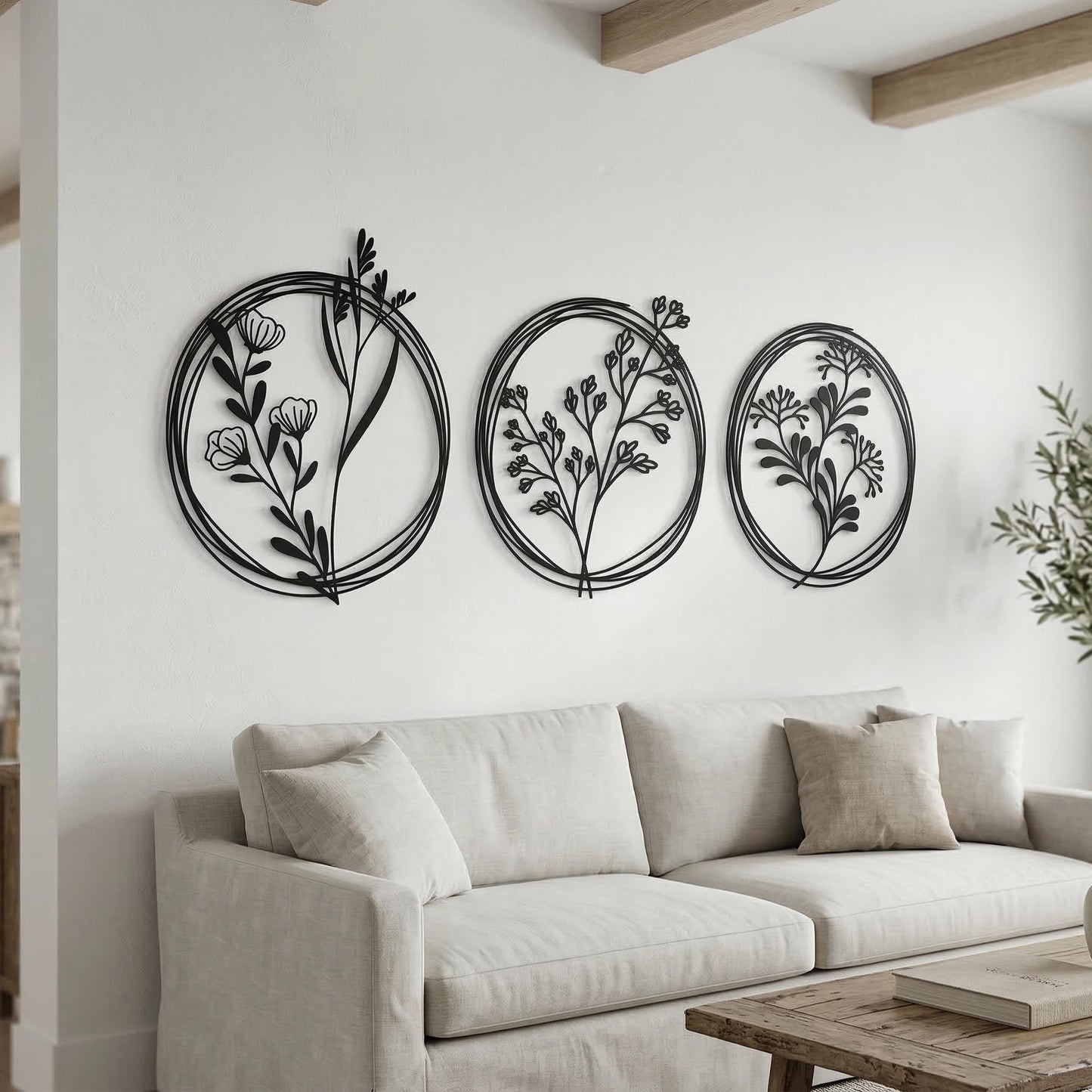 Set of 3 Metal Botanical Flower Wall Art shown on a living room wall