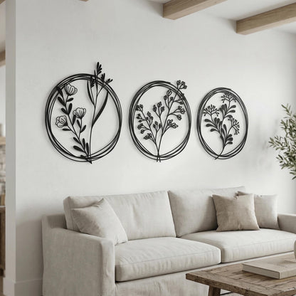 Set of 3 Metal Botanical Flower Wall Art shown on a living room wall